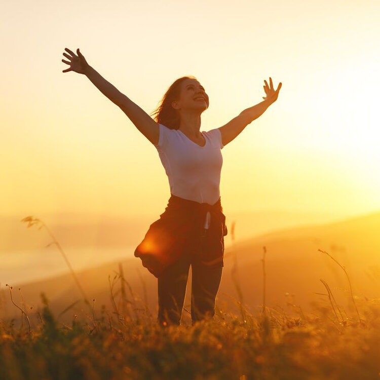 woman standing with arms wide open to naturopathic doctor healing in Scottsdale.